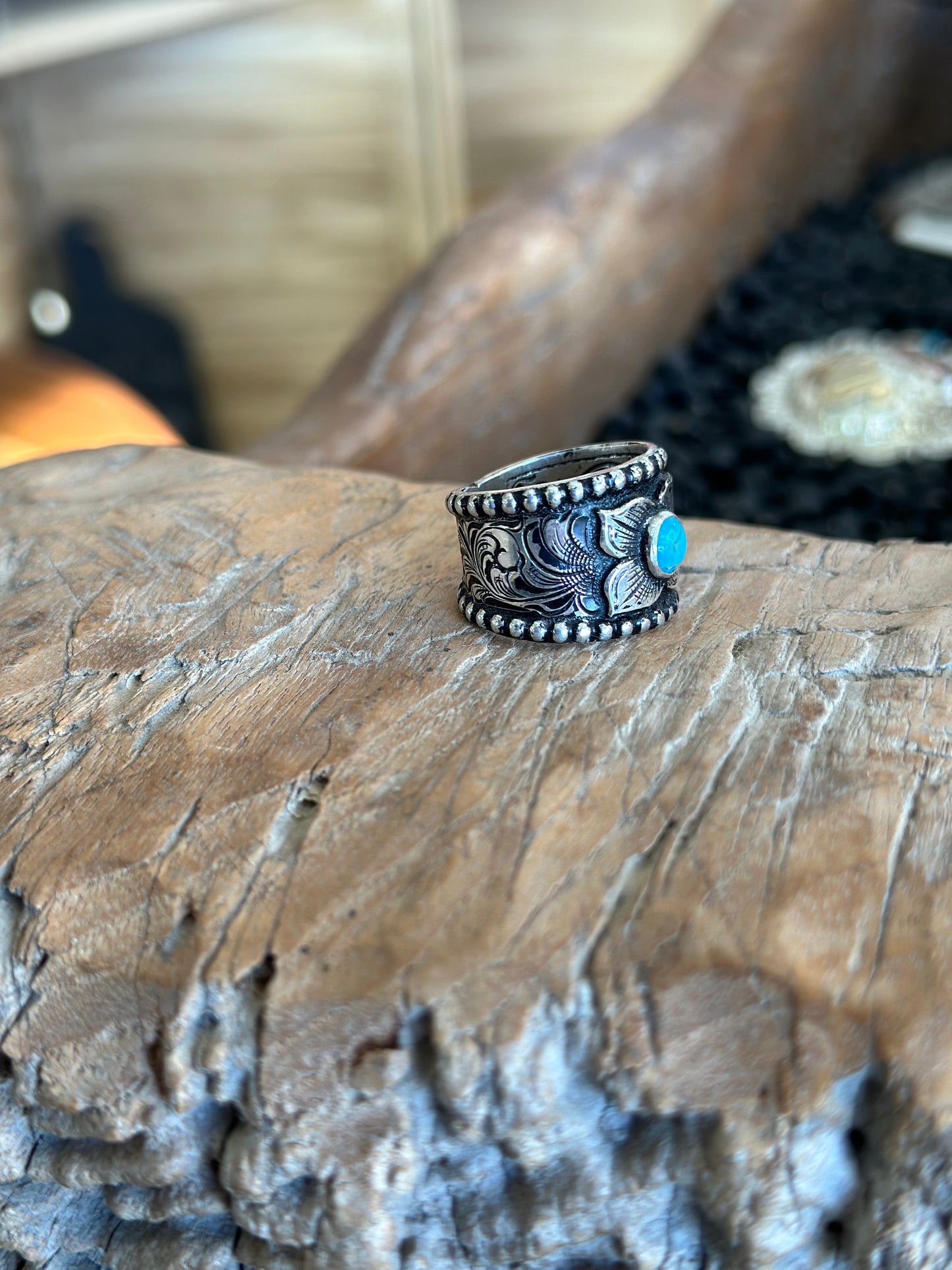 side view of engraved ring with turquoise stone