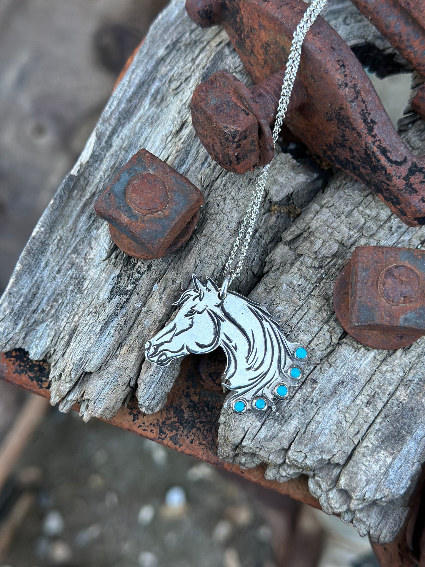 horsehead pendant with turquoise stones