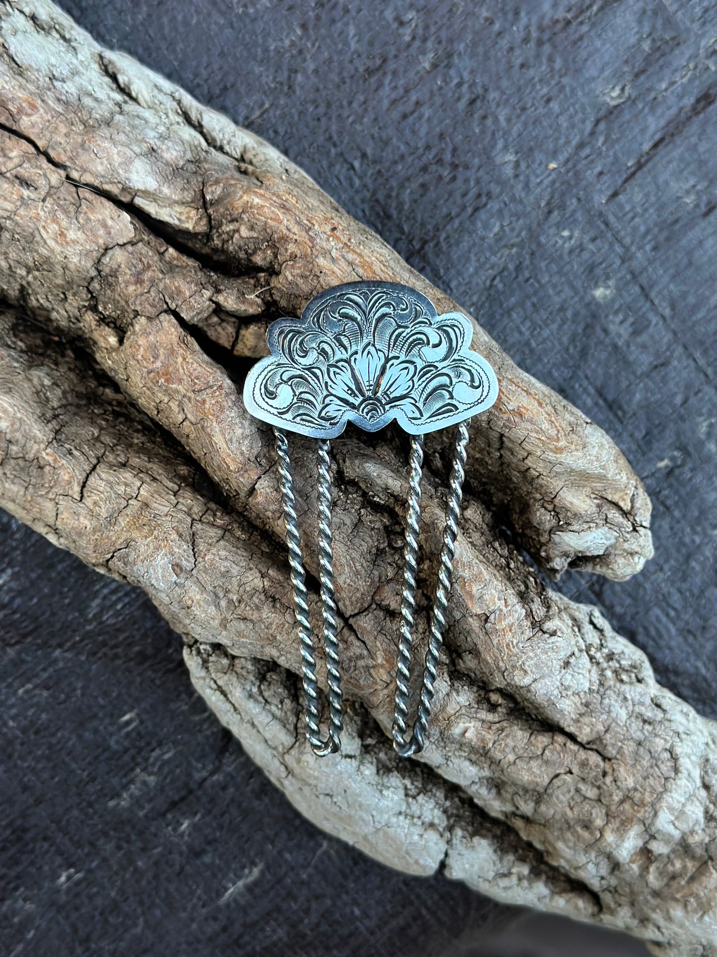 sterling silver hair comb on wood