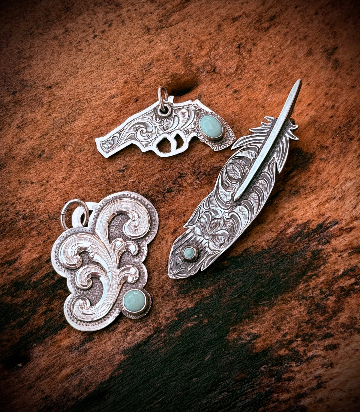 Hand-engraved sterling silver turquoise pendants: Six Shooter, Plume Feather and High Plains Scroll