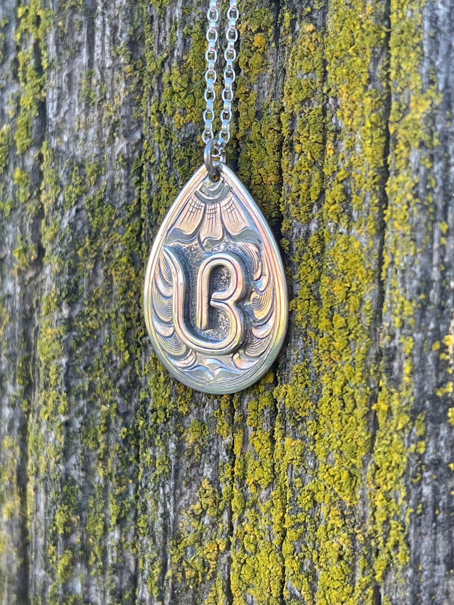 Teardrop Pendant with sterling silver brand